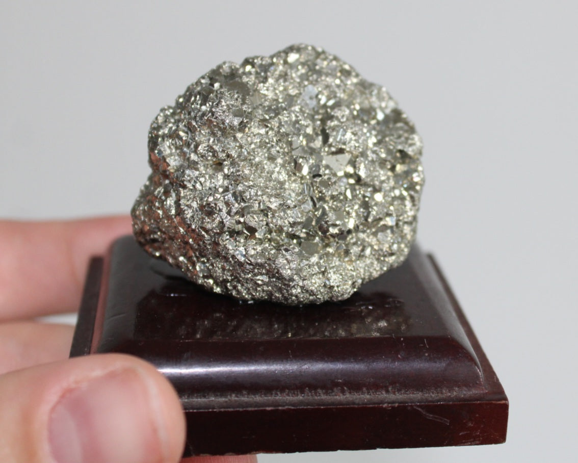 Pyrite geode crystal on platform